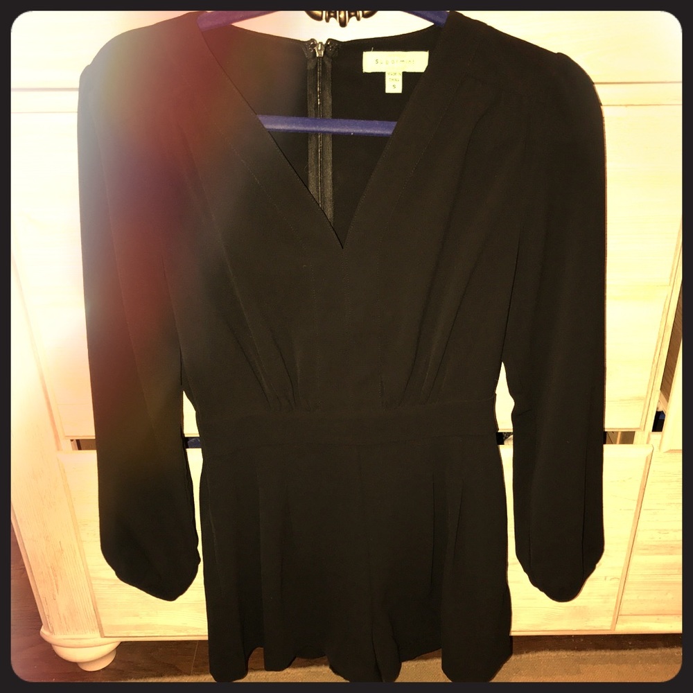 Black long sleeve romper with detailing
